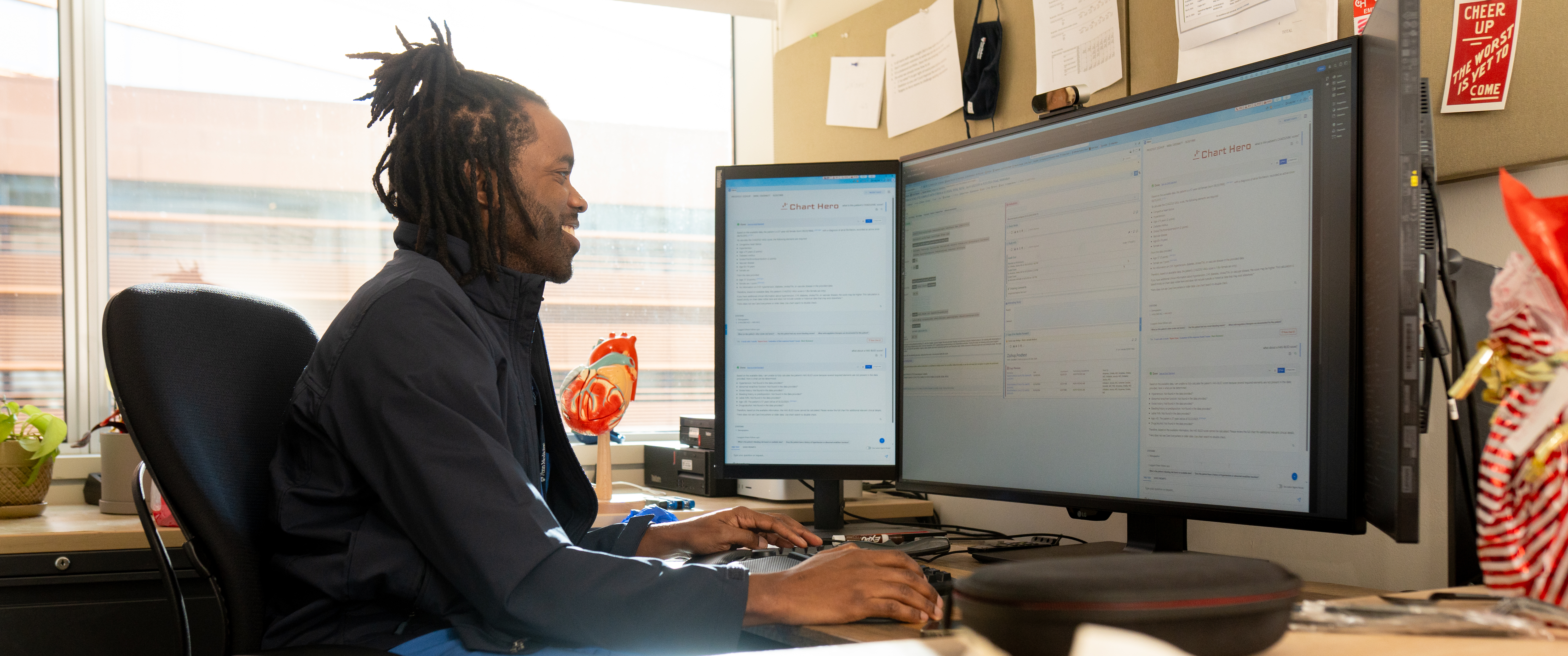 Emeka Anyanwu, a clinician-engineer who uses the Chart Hero platform, is shown using the tool at a computer