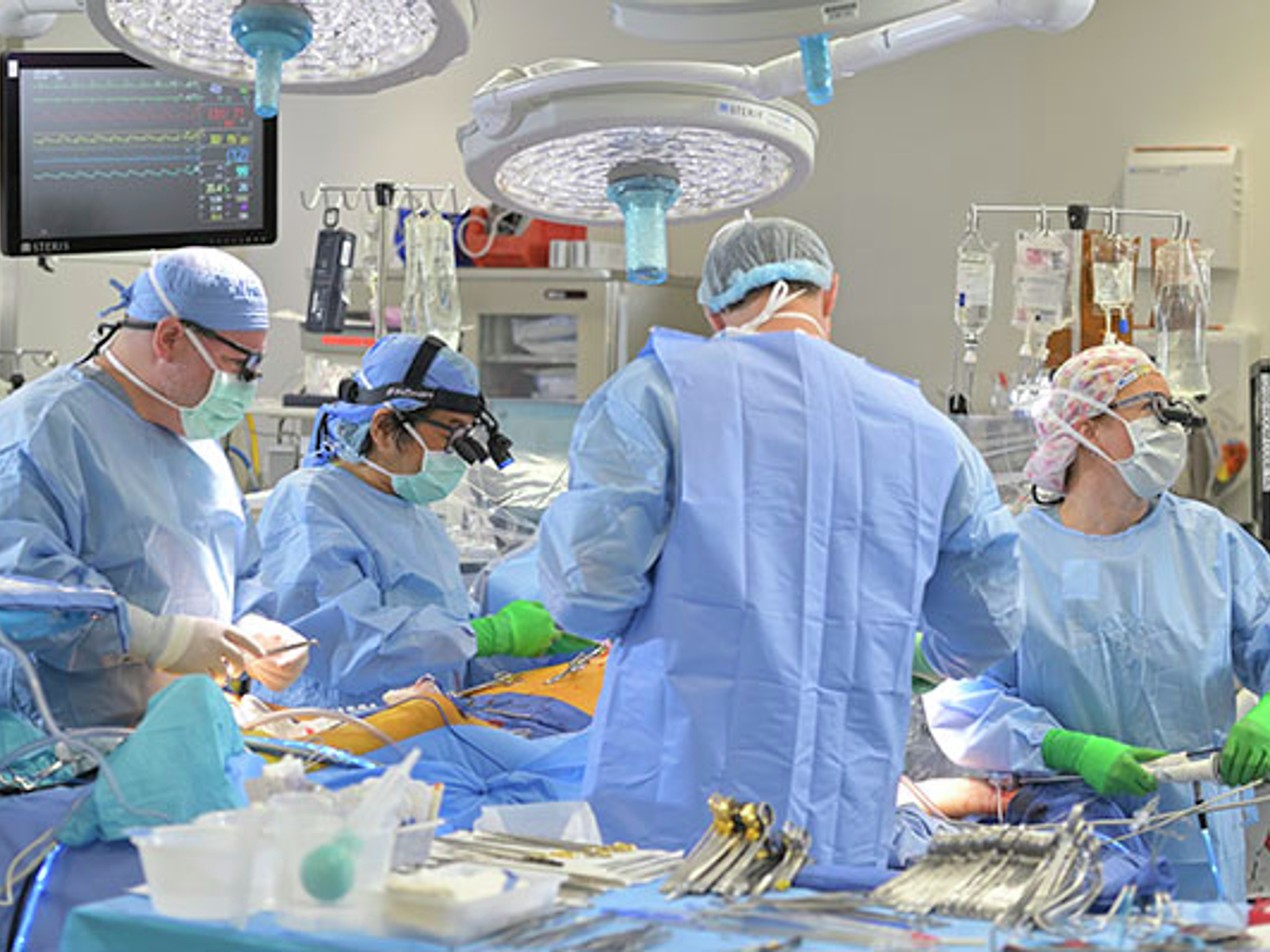 Cardiac surgeons in operating room performing bloodless surgery