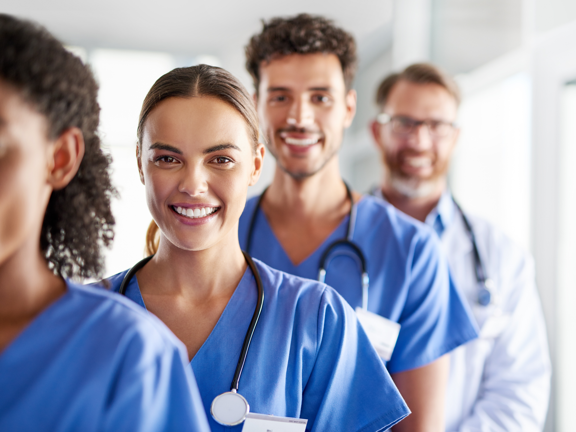 Portrait of a diverse team of doctors standing together in a hospital