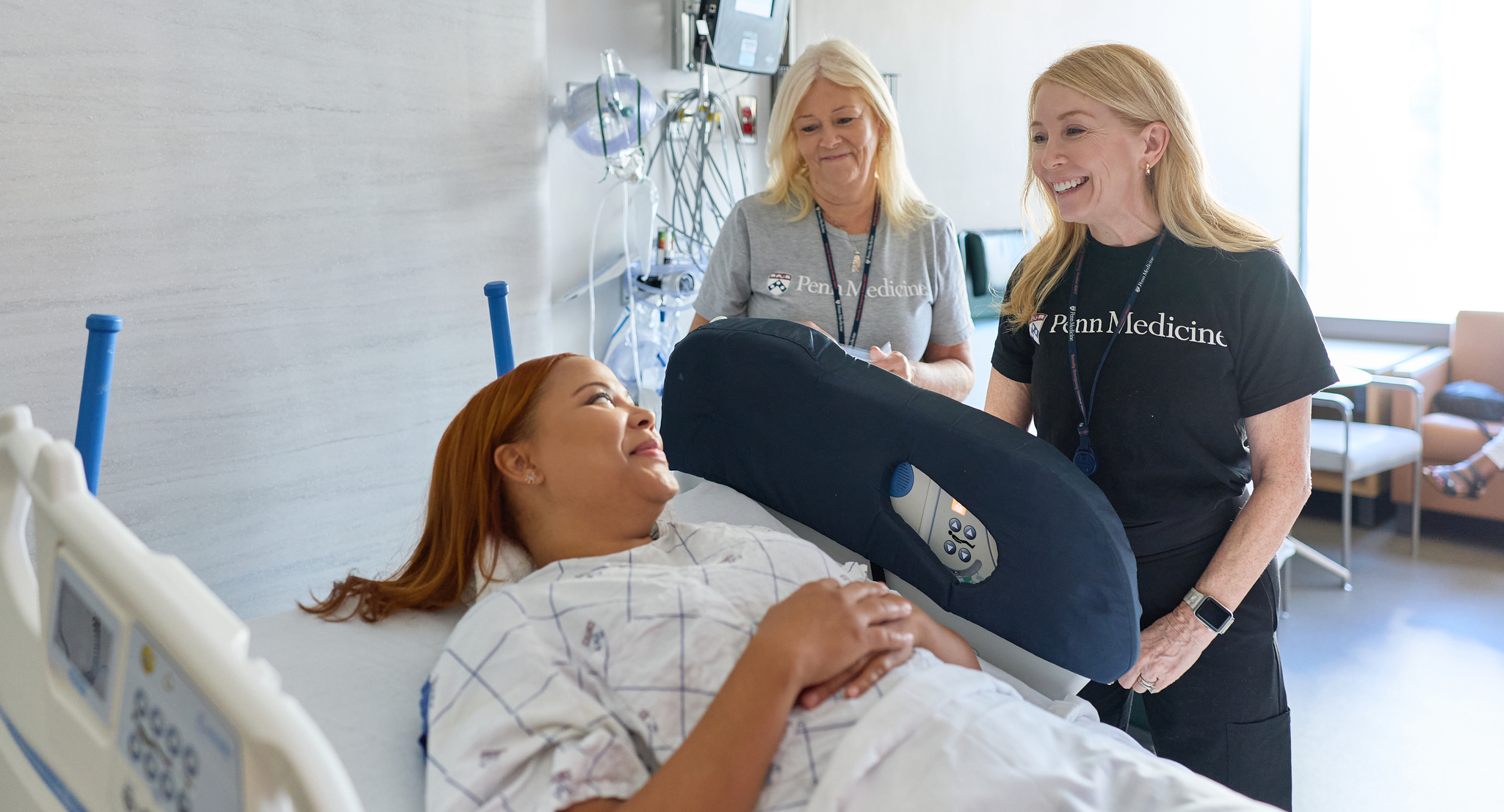 Nurses visiting a patient before surgery in an hospital room