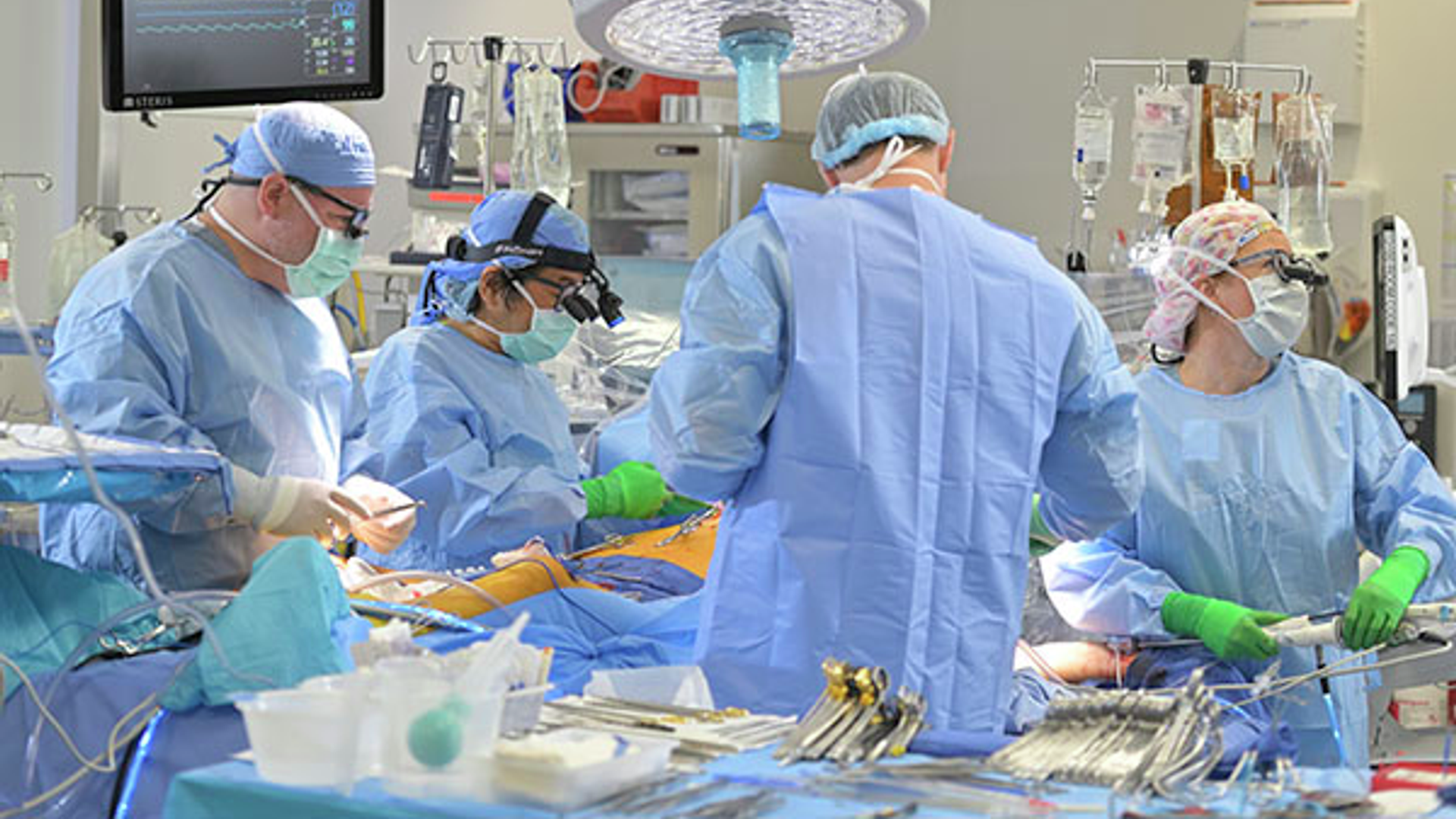 Cardiac surgeons in operating room performing bloodless surgery