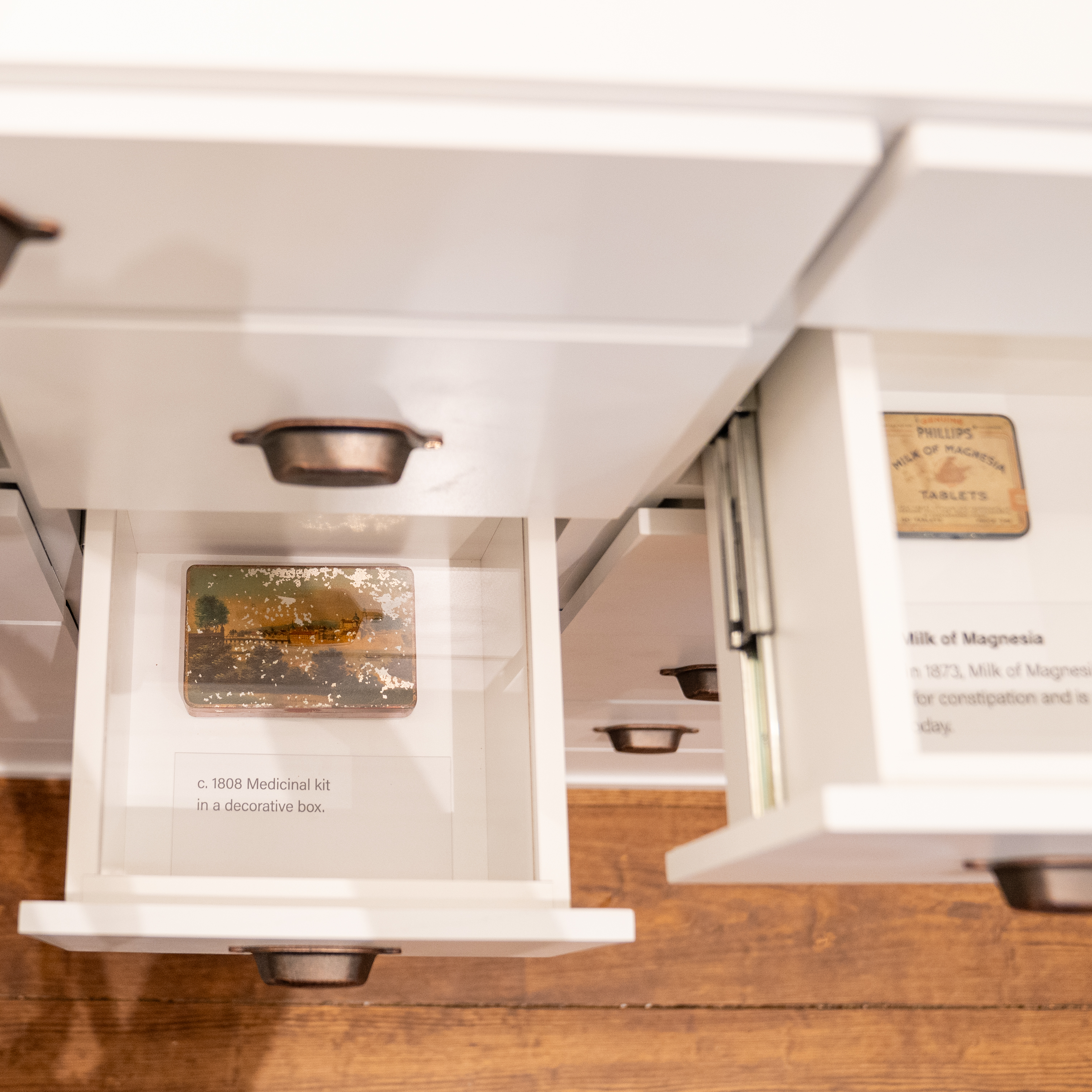 Drawers opened to reveal old apothecary items in the Pennsylvania Hospital museum