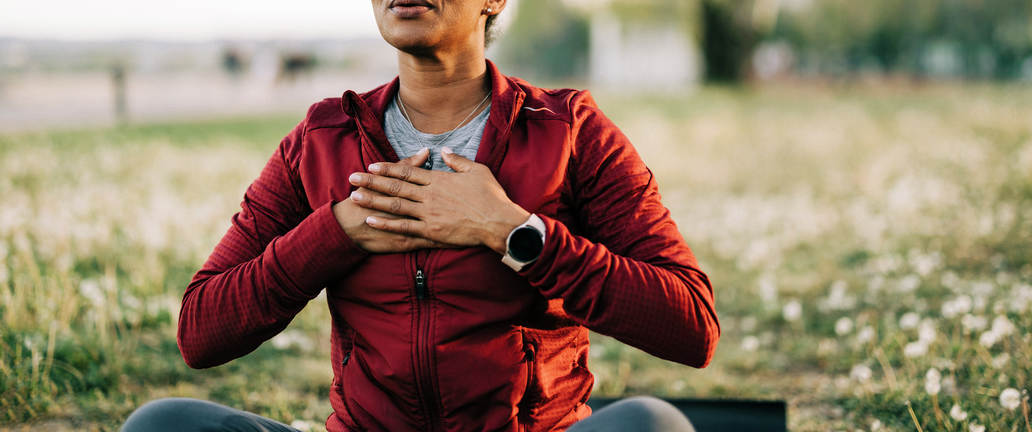 Black woman, breath and hand on chest, for meditation and wellness being peaceful to relax