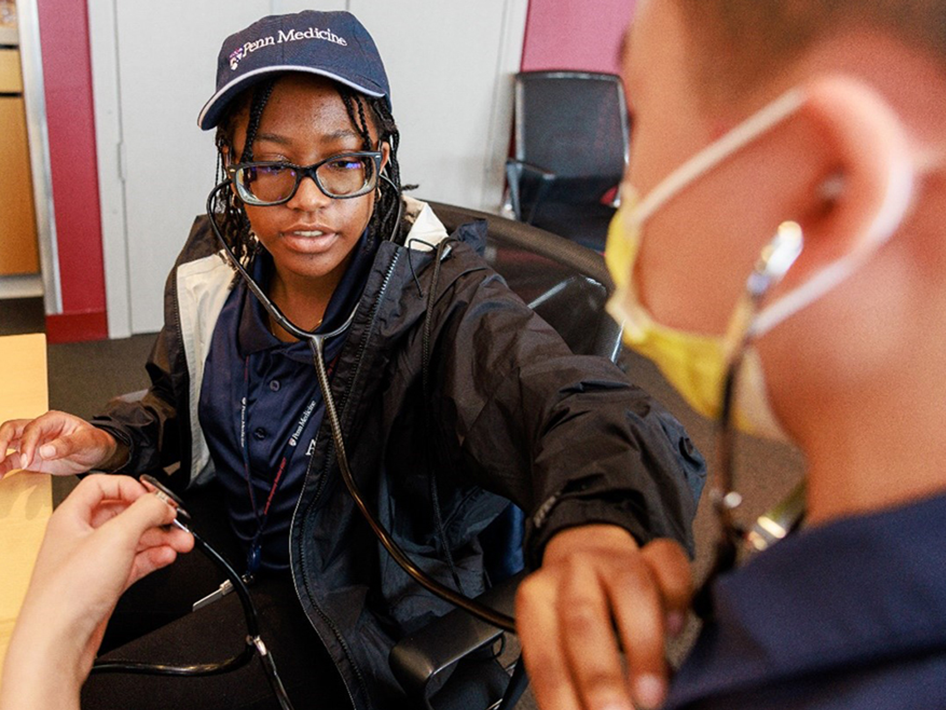 Student checking heart rate in class