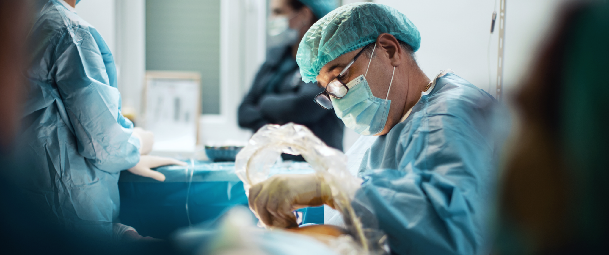 Surgeons operating on a patient