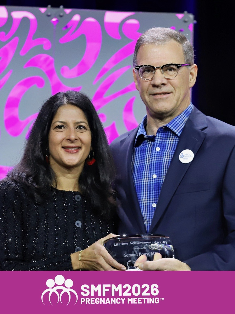 Samuel Parry holding the 2026 Society of Maternal Fetal Medicine Lifetime Achievement Award, standing next to Sindhu K. Srinivas, who presented the award