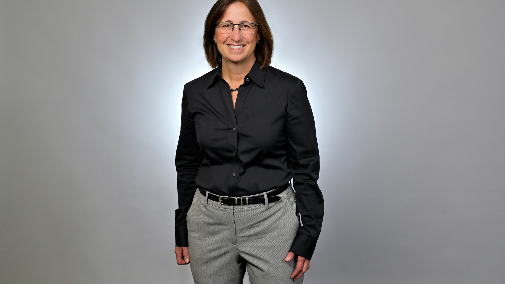 Lisa Bellini standing in business attire