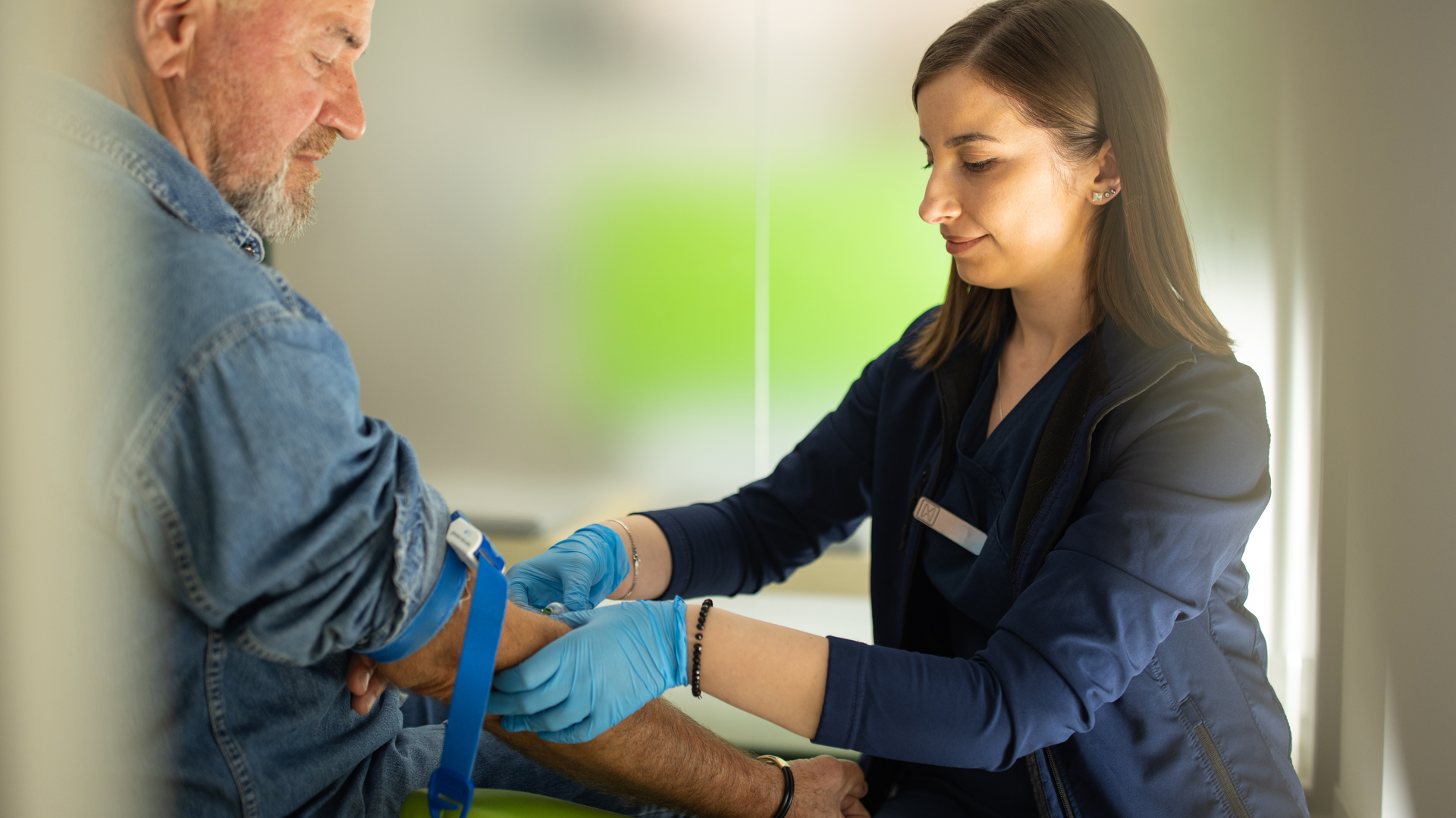 Blood test with senior man by female doctor