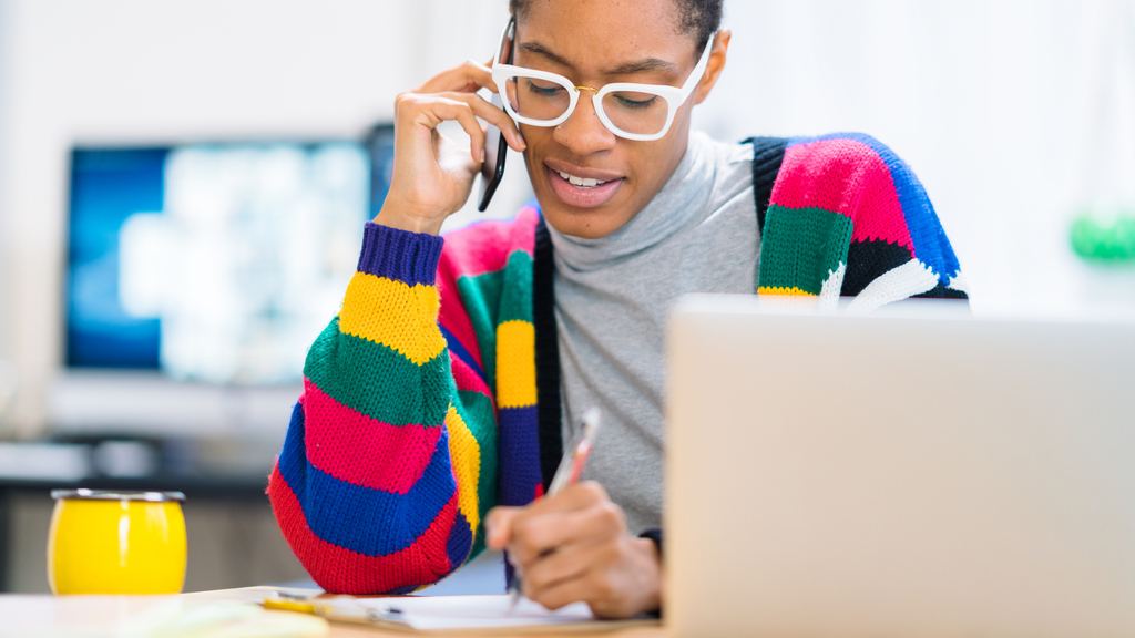 Young woman working on laptop at home