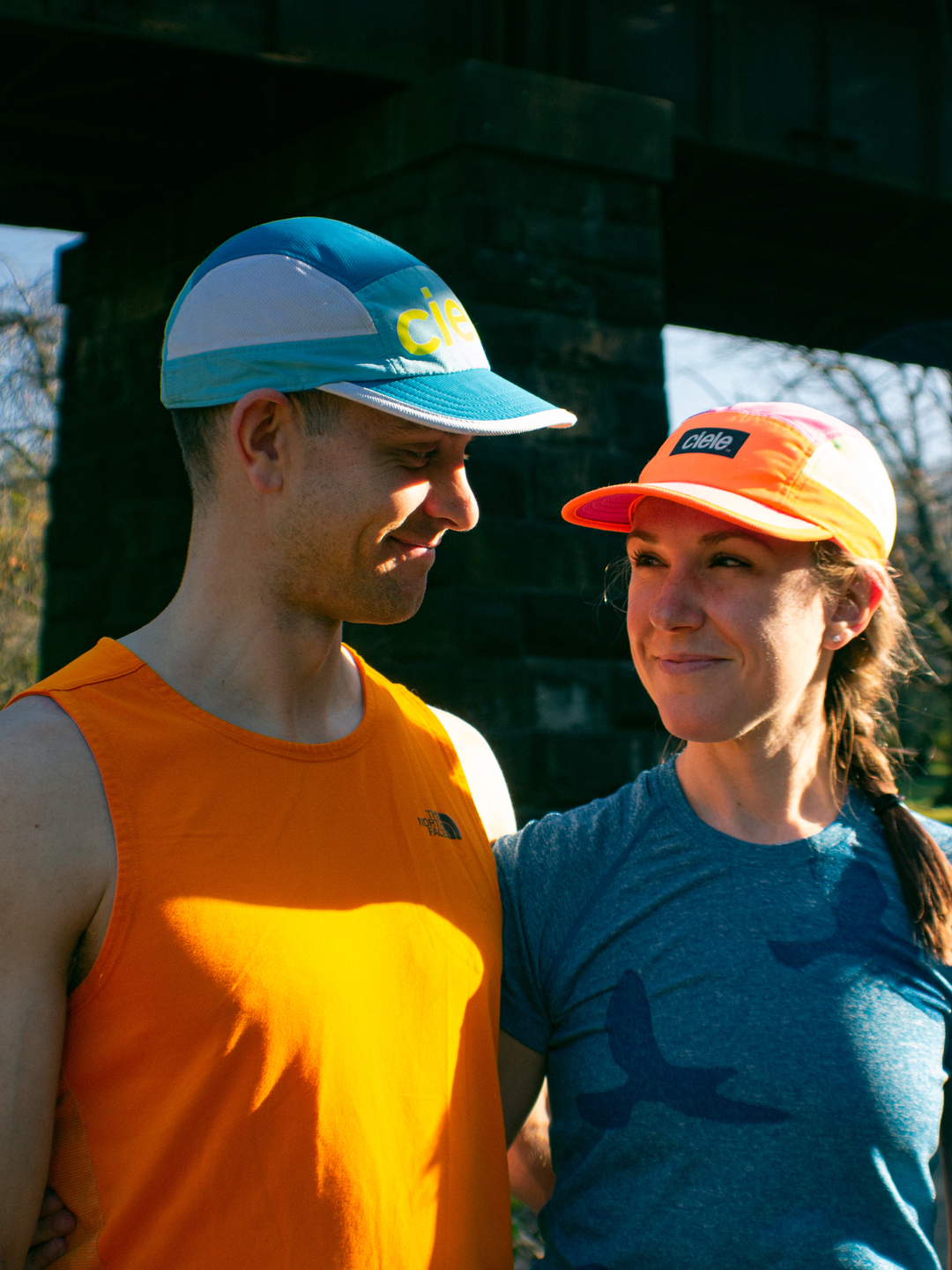 Eric and Claire Todd, wearing running gear, looking at one another