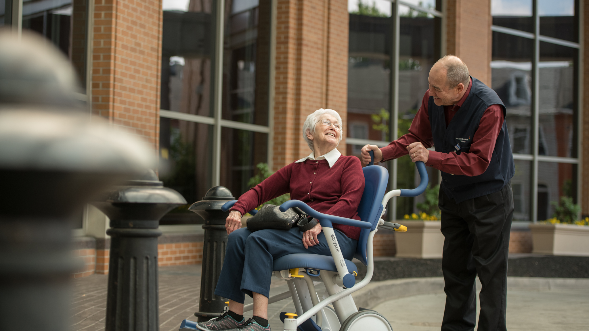 Lancaster General Hospital volunteer, Stephen Engle, transporting elderly patient