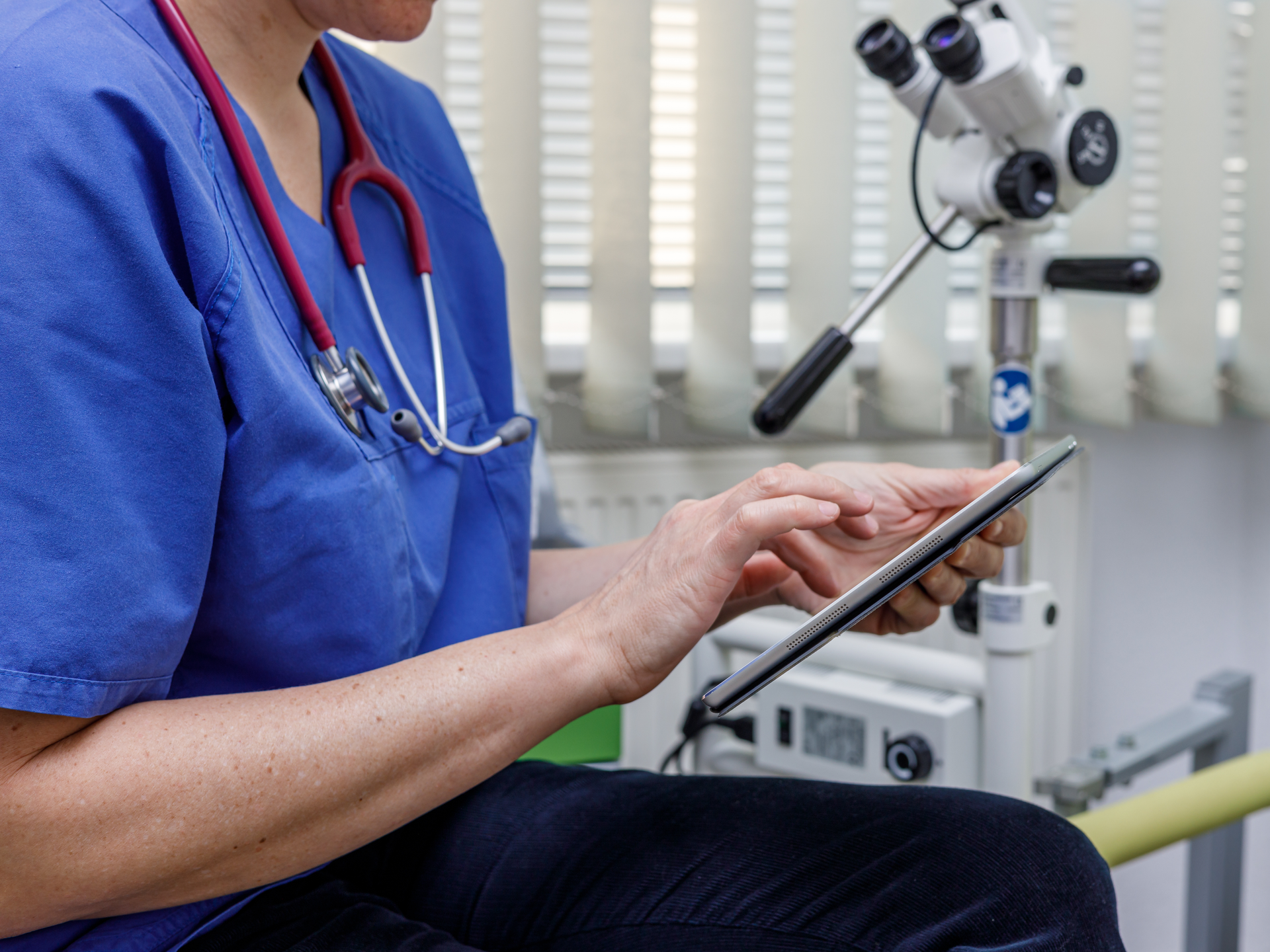 Doctor with ipad for robotic urology consultation.jpg