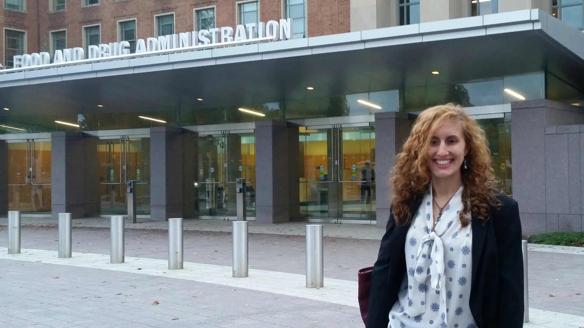 Katelyn Corey standing outside of a Food and Drug Administration building