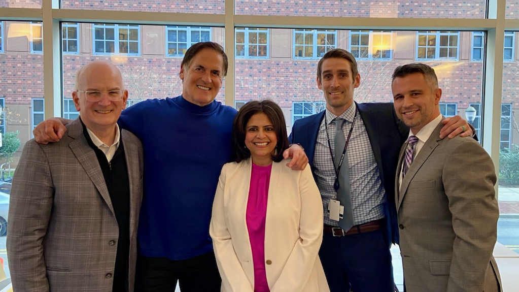 A group photo that includes Kevin Mahoney, Mark Cuban, Nishaminy Kasbekar, and others at Penn