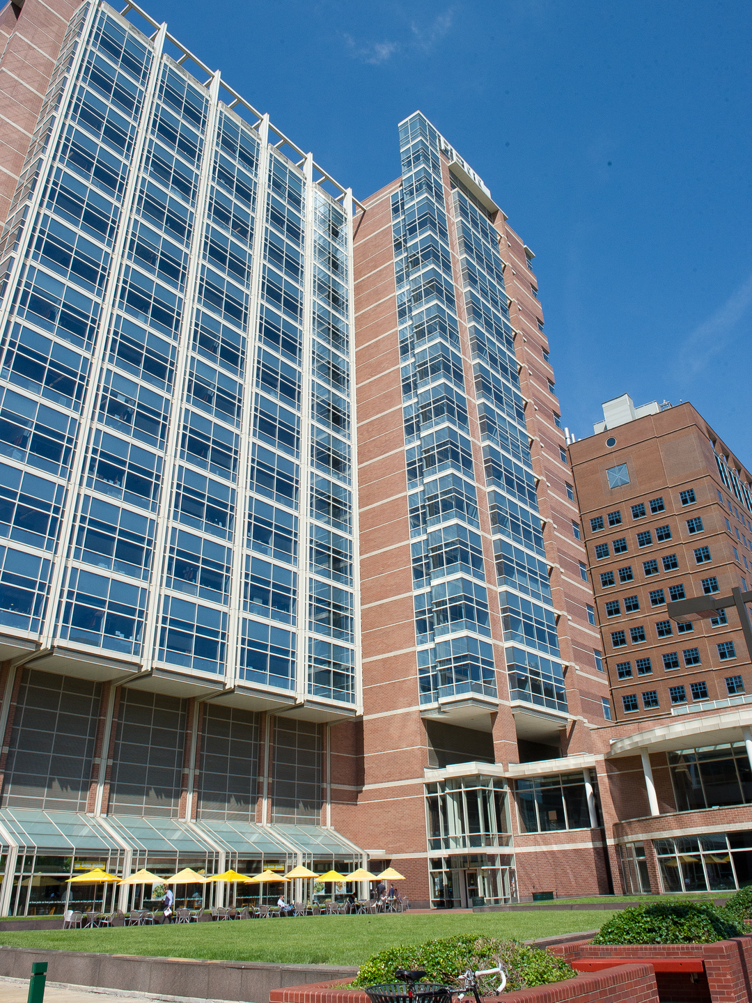 The building long known as Biomedical Research Building III/III, a tall brick building with windows covering much of the façade, and the word “PENN” in lights at the top
